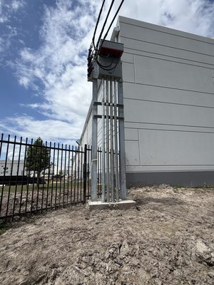 Riser and meter cabinet mounted on galvanized posts over a concrete pad base