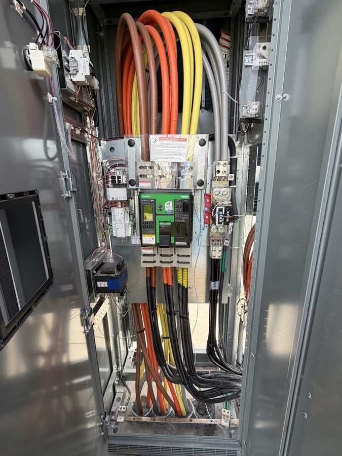 Orange, yellow and gray cable bundles terminated to a molded-case breaker